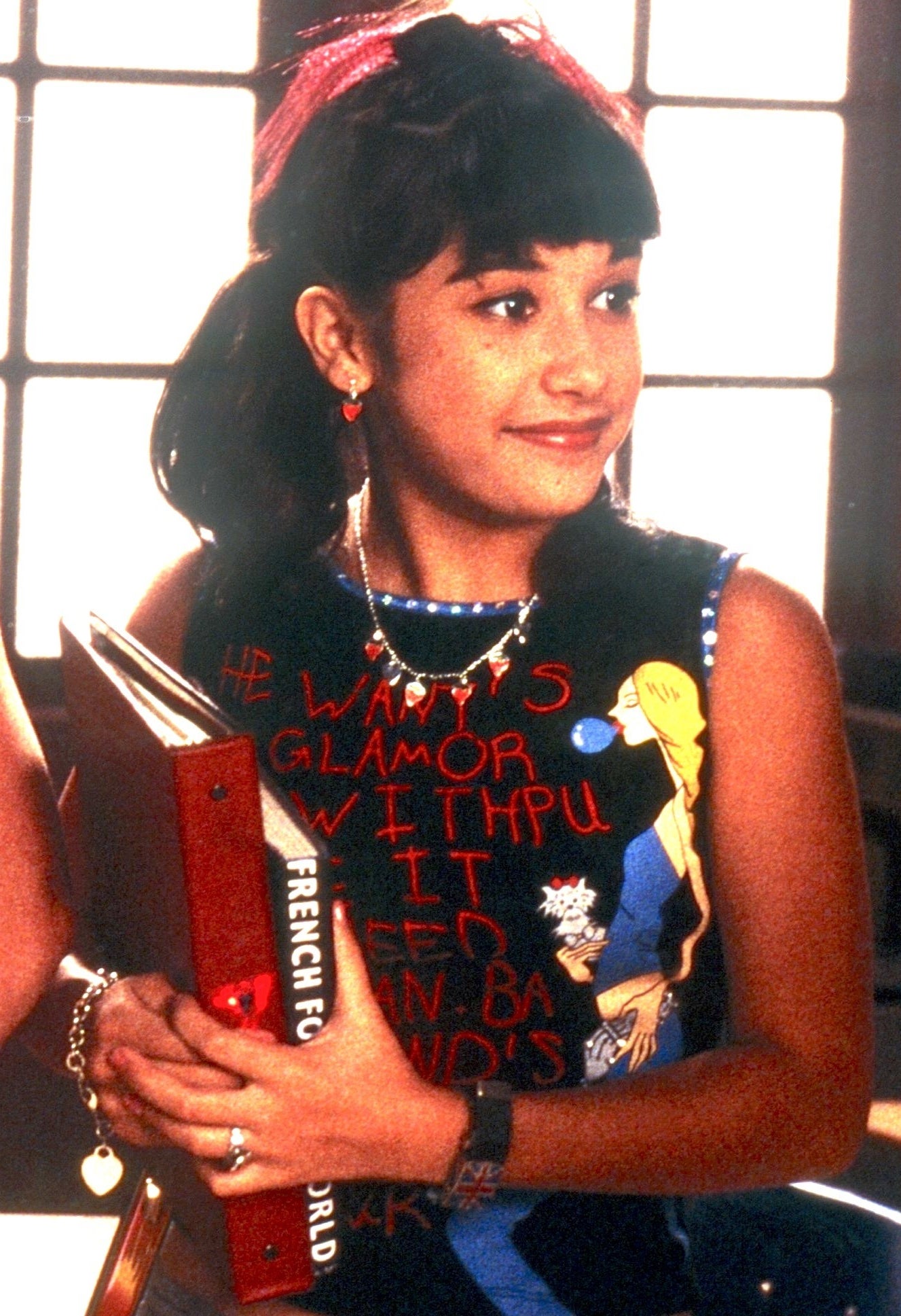 LaLaine wearing a T-shirt with writing on it