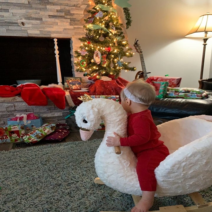 a young child on the swan rocker