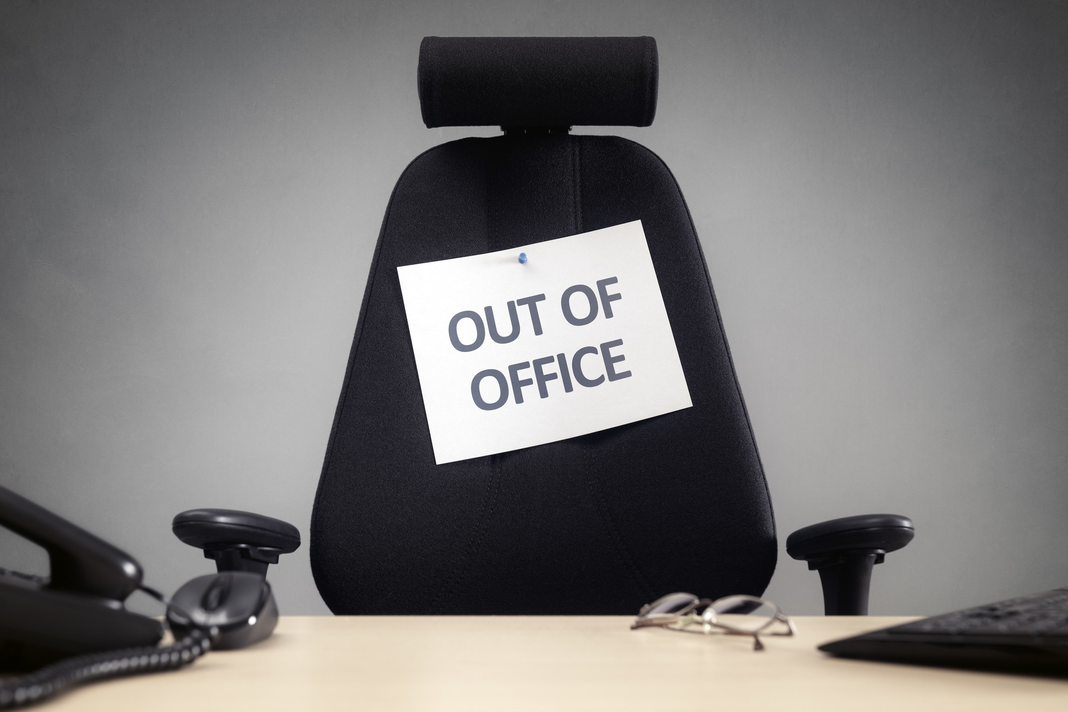 An &quot;Out of office&quot; sign on a chair