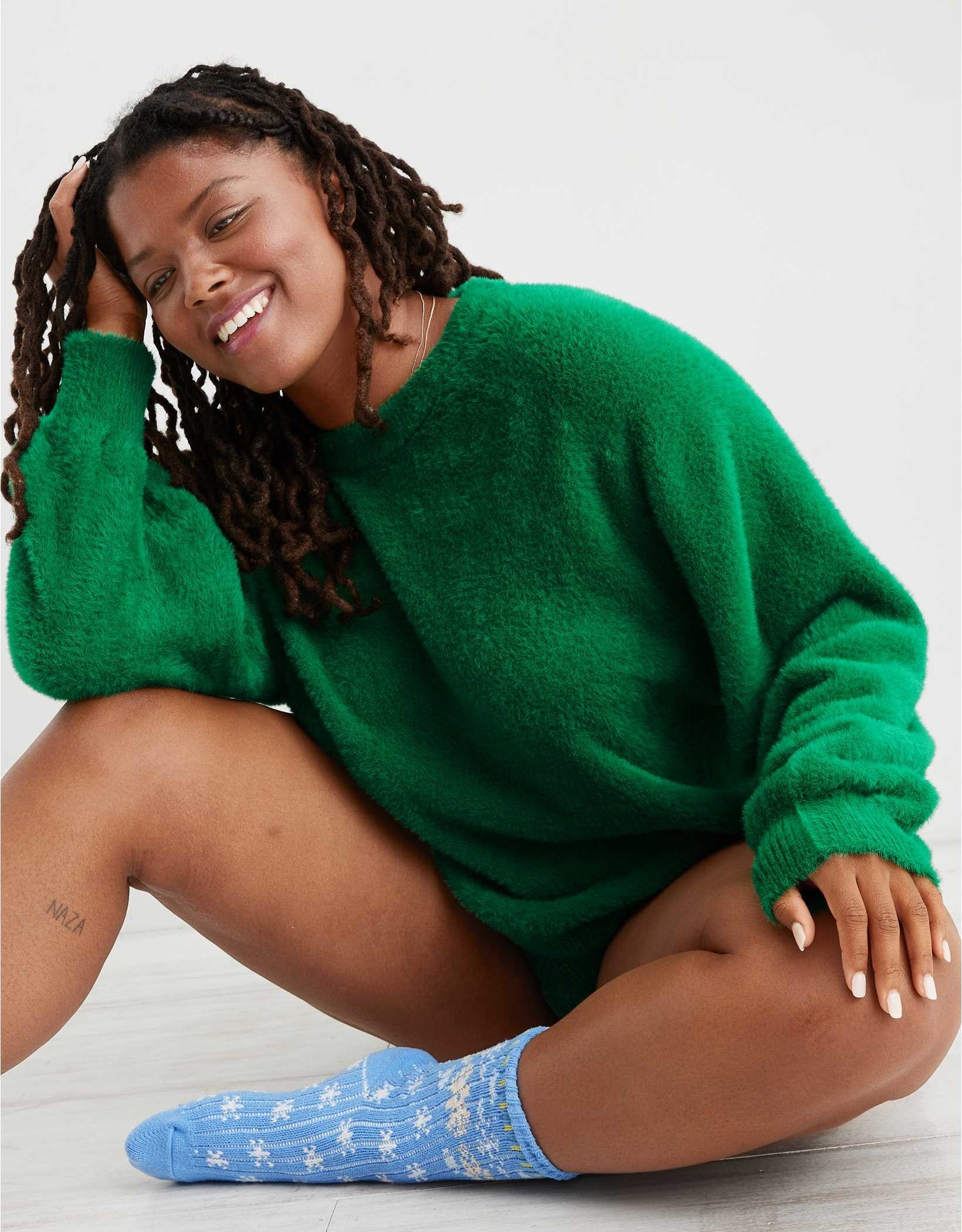 A model in the bright leaf green sweater