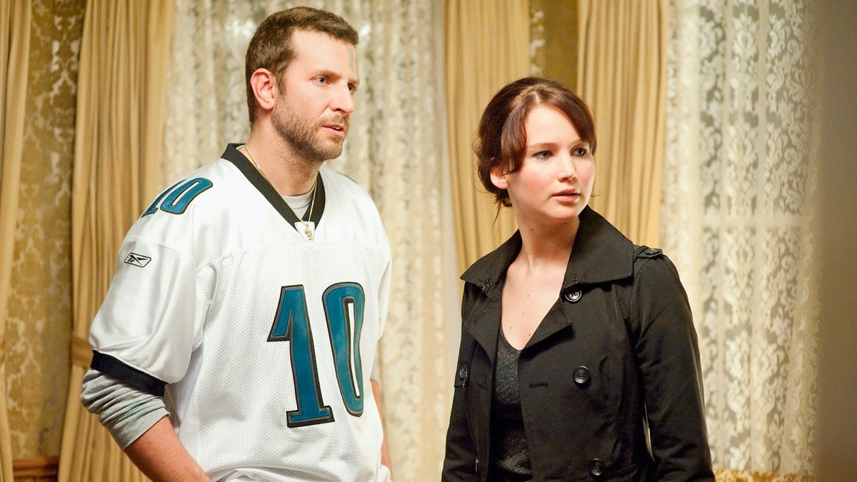 Bradley Cooper and Jennifer Lawrence looking at something