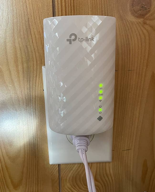reviewer's TP-Link AC750 Wifi Range Extender plugged in