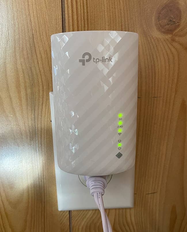 reviewer's TP-Link AC750 Wifi Range Extender plugged in