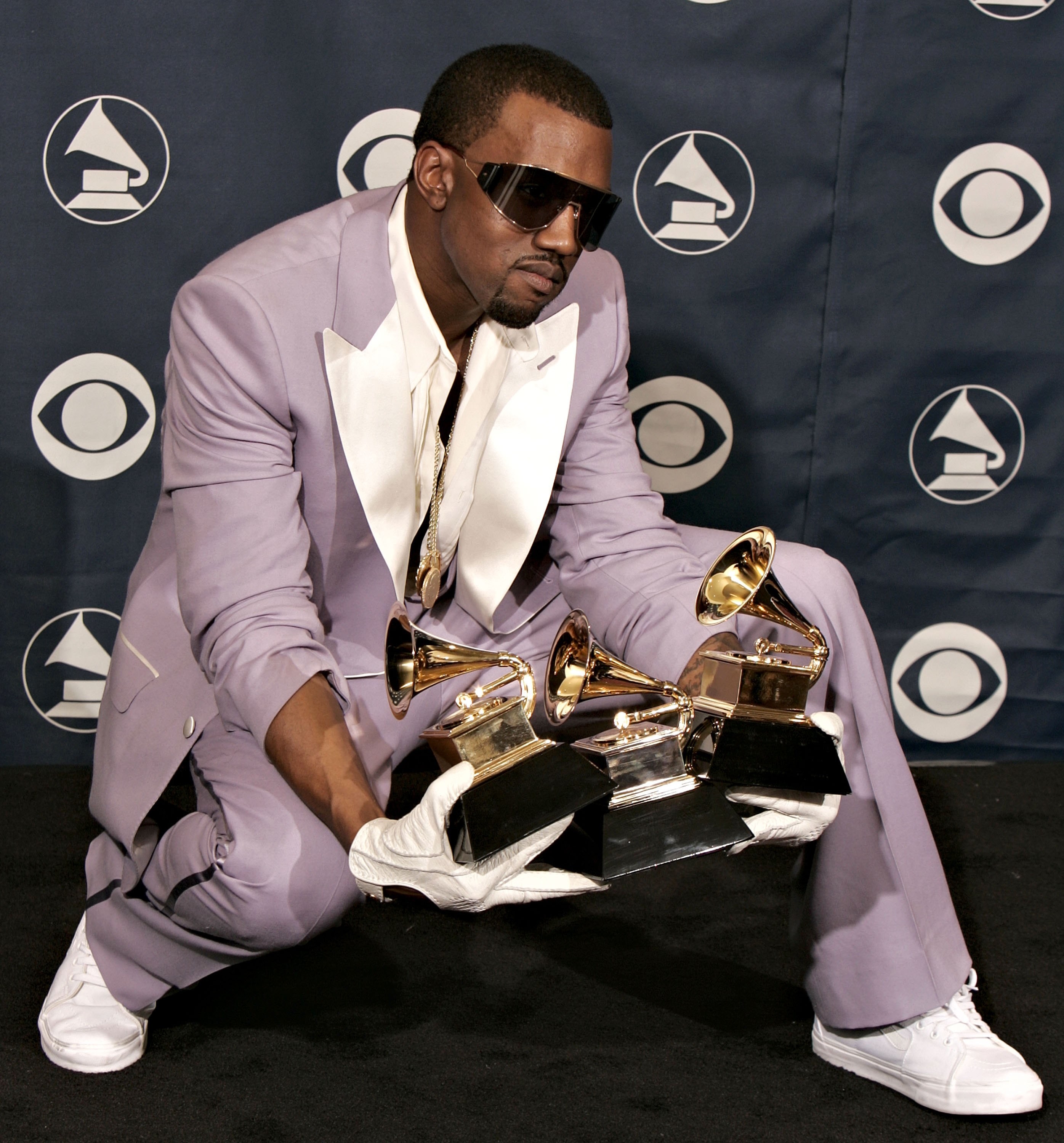 Ye holding Grammys