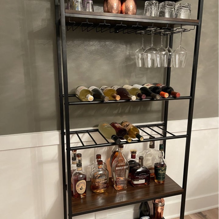 reviewer's wine storage shelf with two racks for horizontal bottles, and shelf, and a place to hang glasses