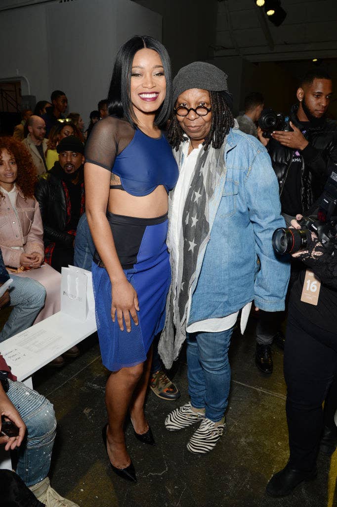 Keke and Whoopi smile and pose together for a photo at an event