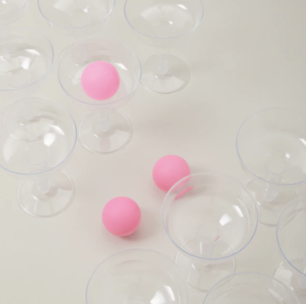 the pong cups and balls on a plain background