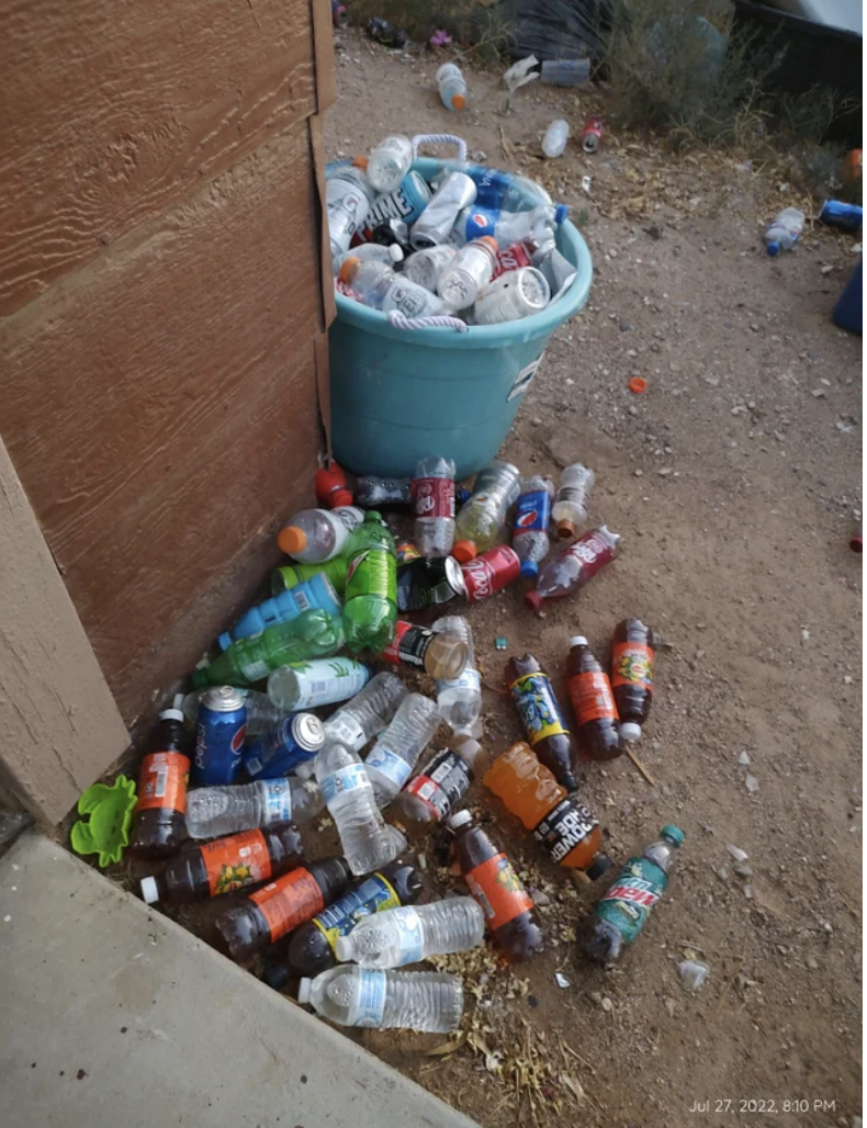 A bunch of bottles thrown on the ground