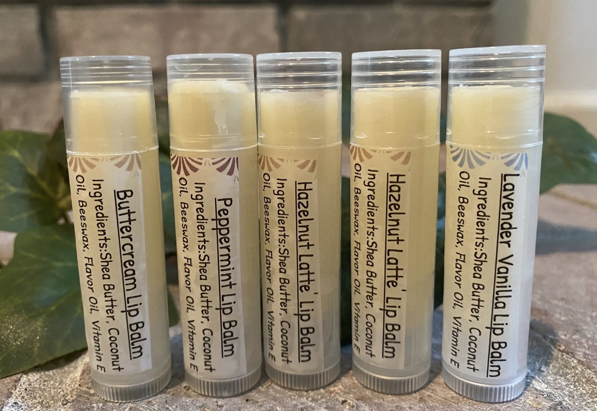 five of the lip balms on a counter