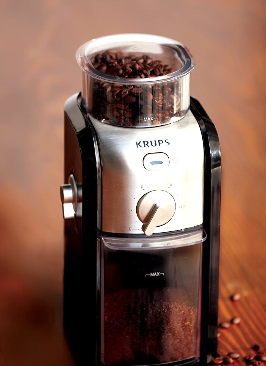 The coffee grinder with beans inside of it