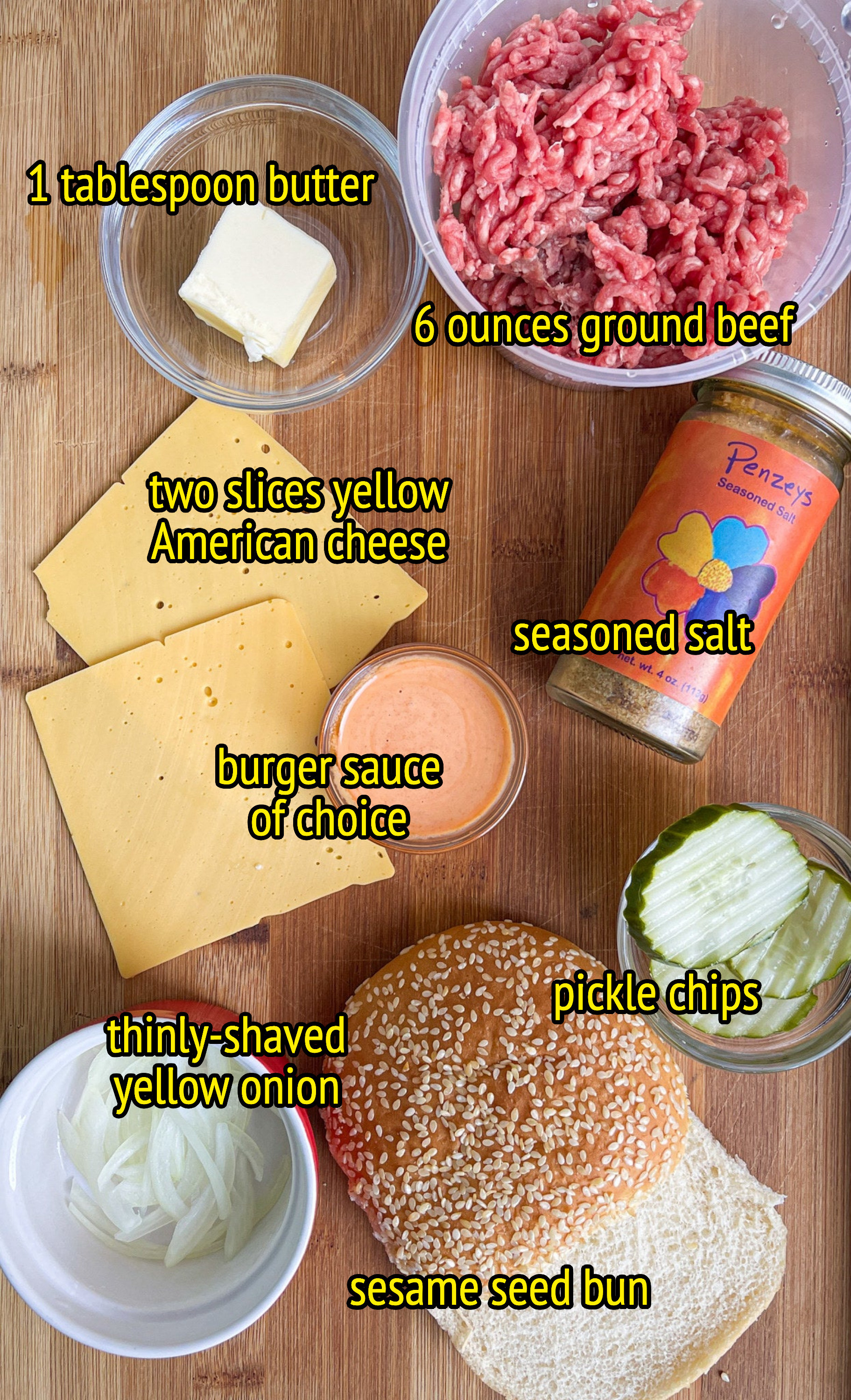 1 tablespoon butter, 6 ounces ground beef, two slices yellow american cheese, seasoned salt, burger sauce of choice, pickle chips, thinly shaved yellow onion, sesame seed bun