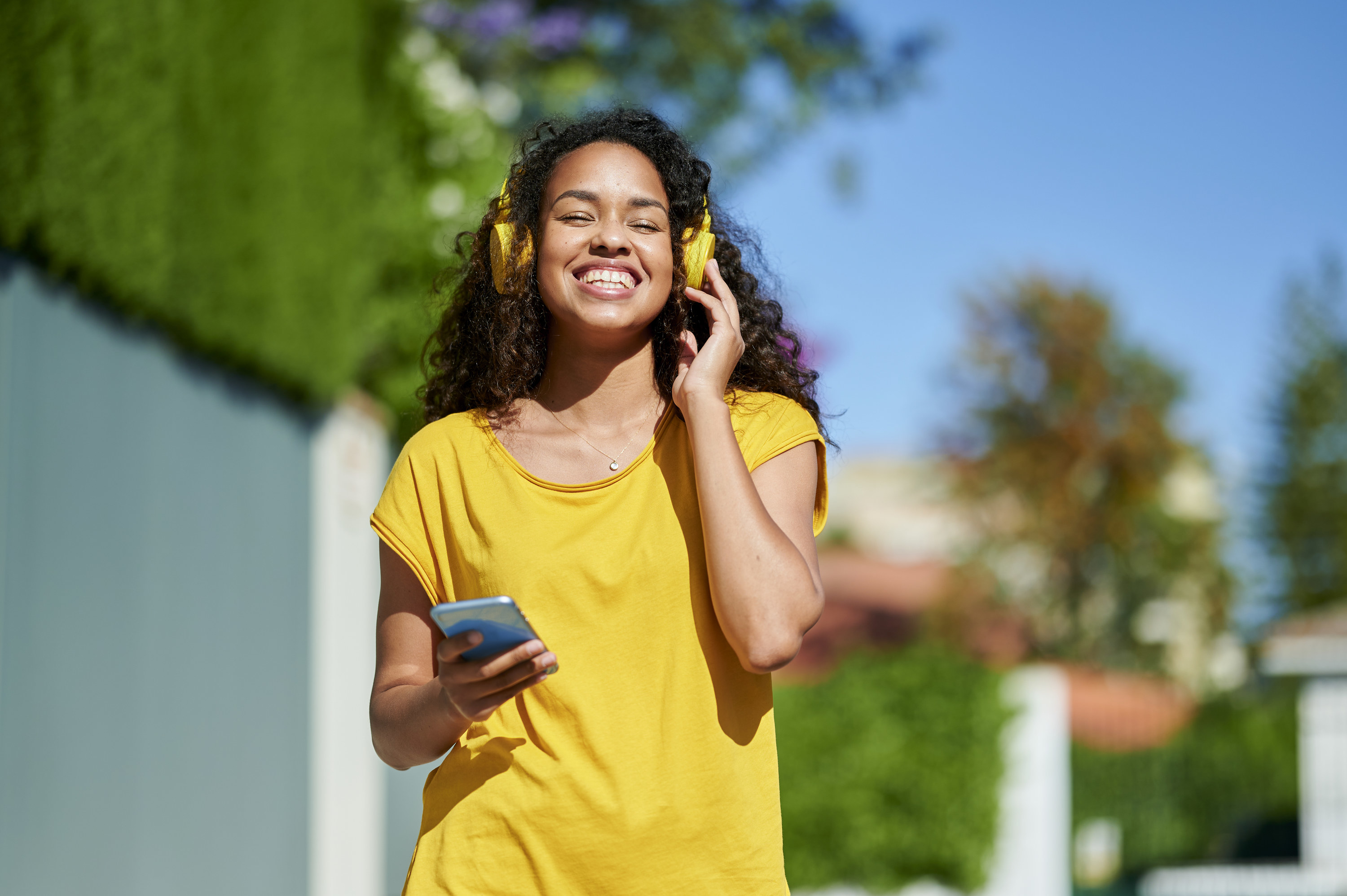 Woman listening to a podcast while going for a walk