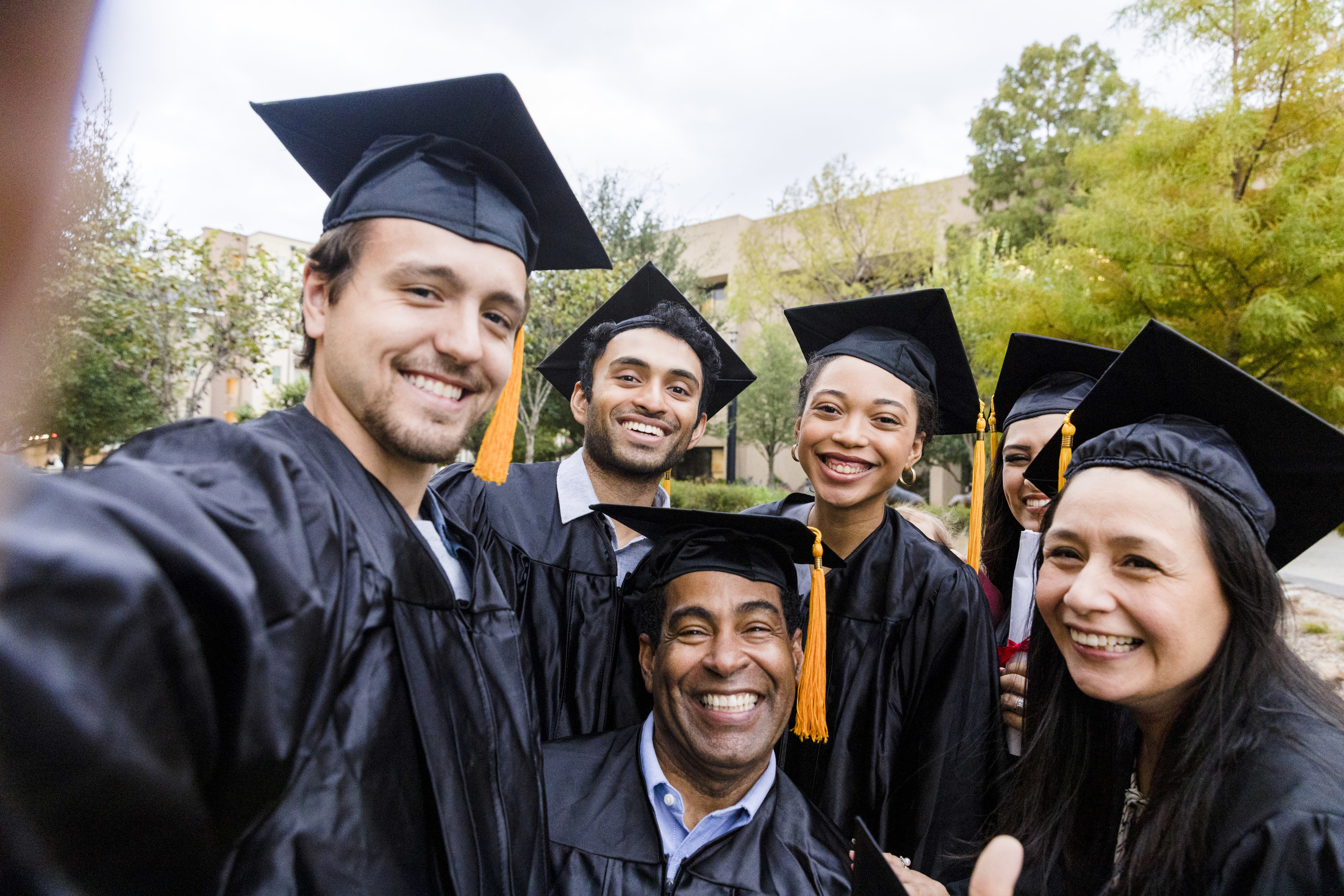 College graduates posing together