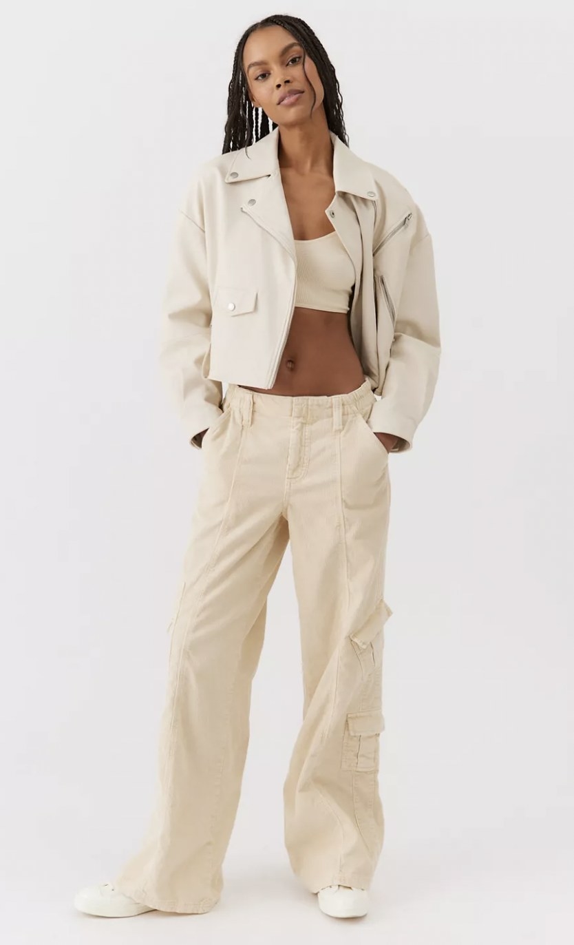 a model wearing the pants in cream
