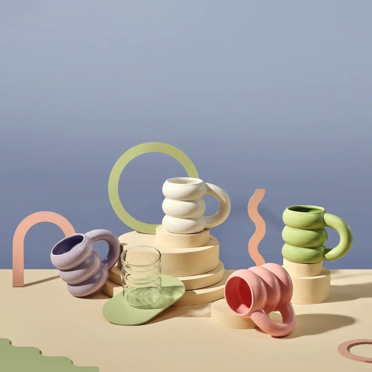 cloud-shaped mugs in pink, white, purple, and green colors