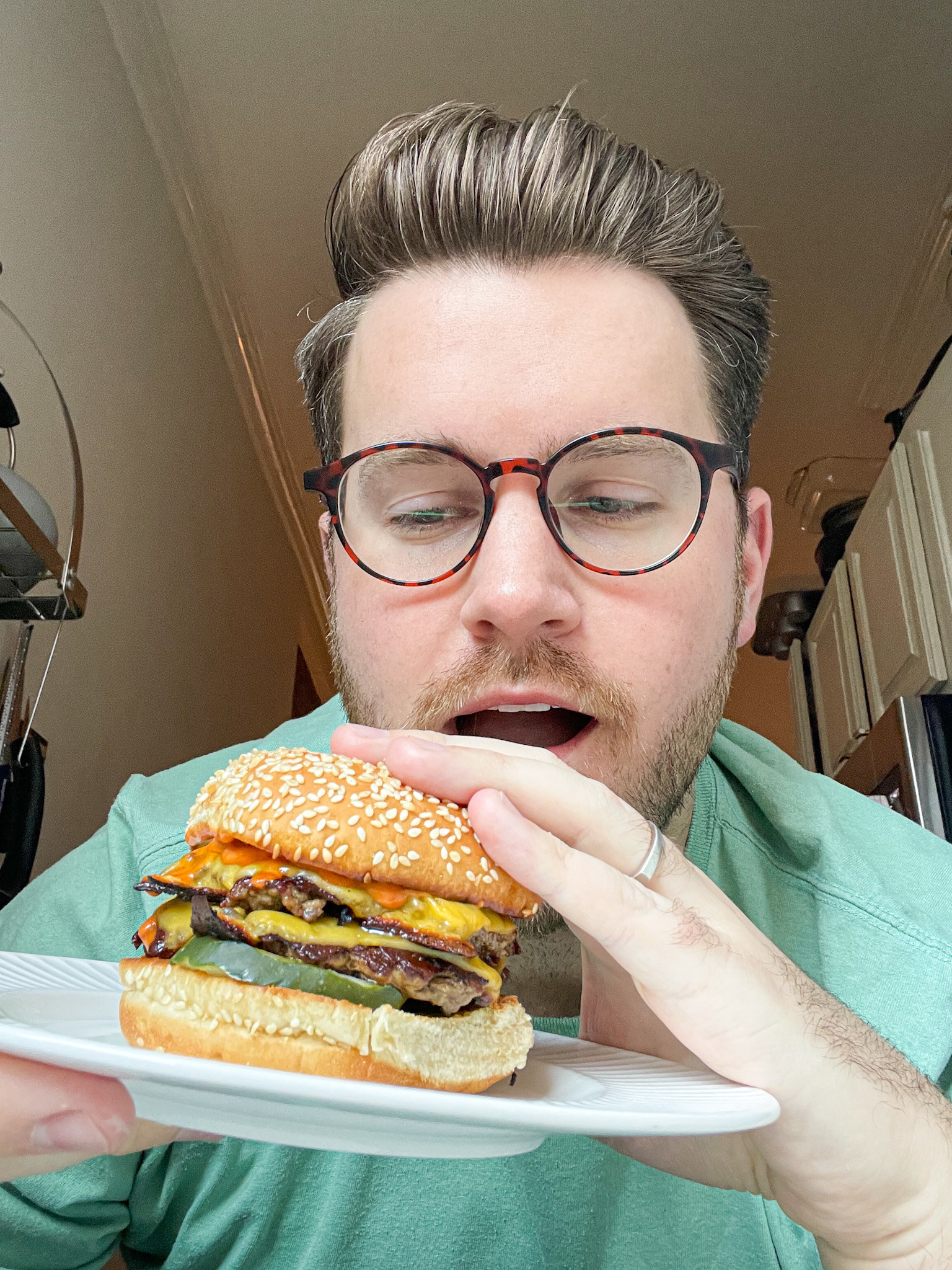 author holding the burger in hand