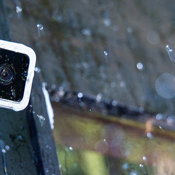 Wyze camera mounted outside in the rain showing waterproof
