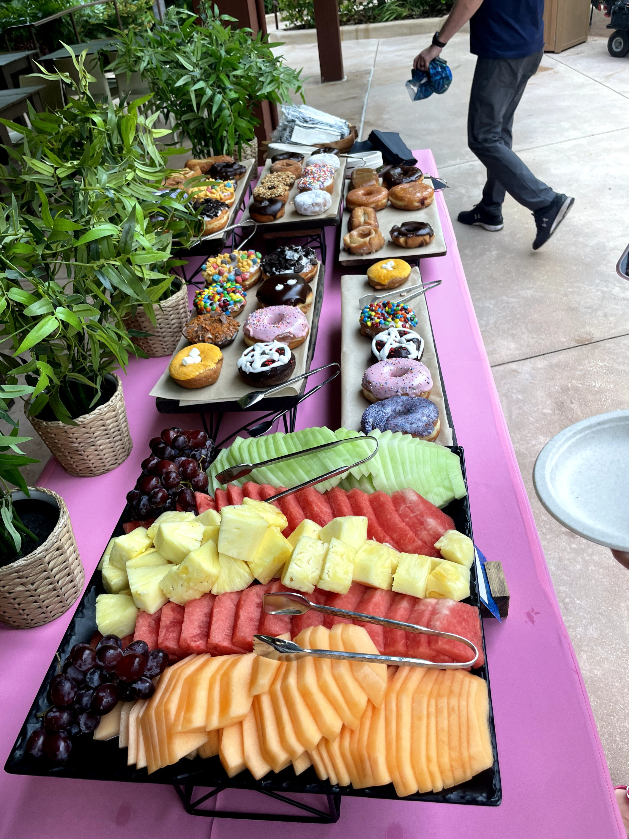 table full of fruit and donuts