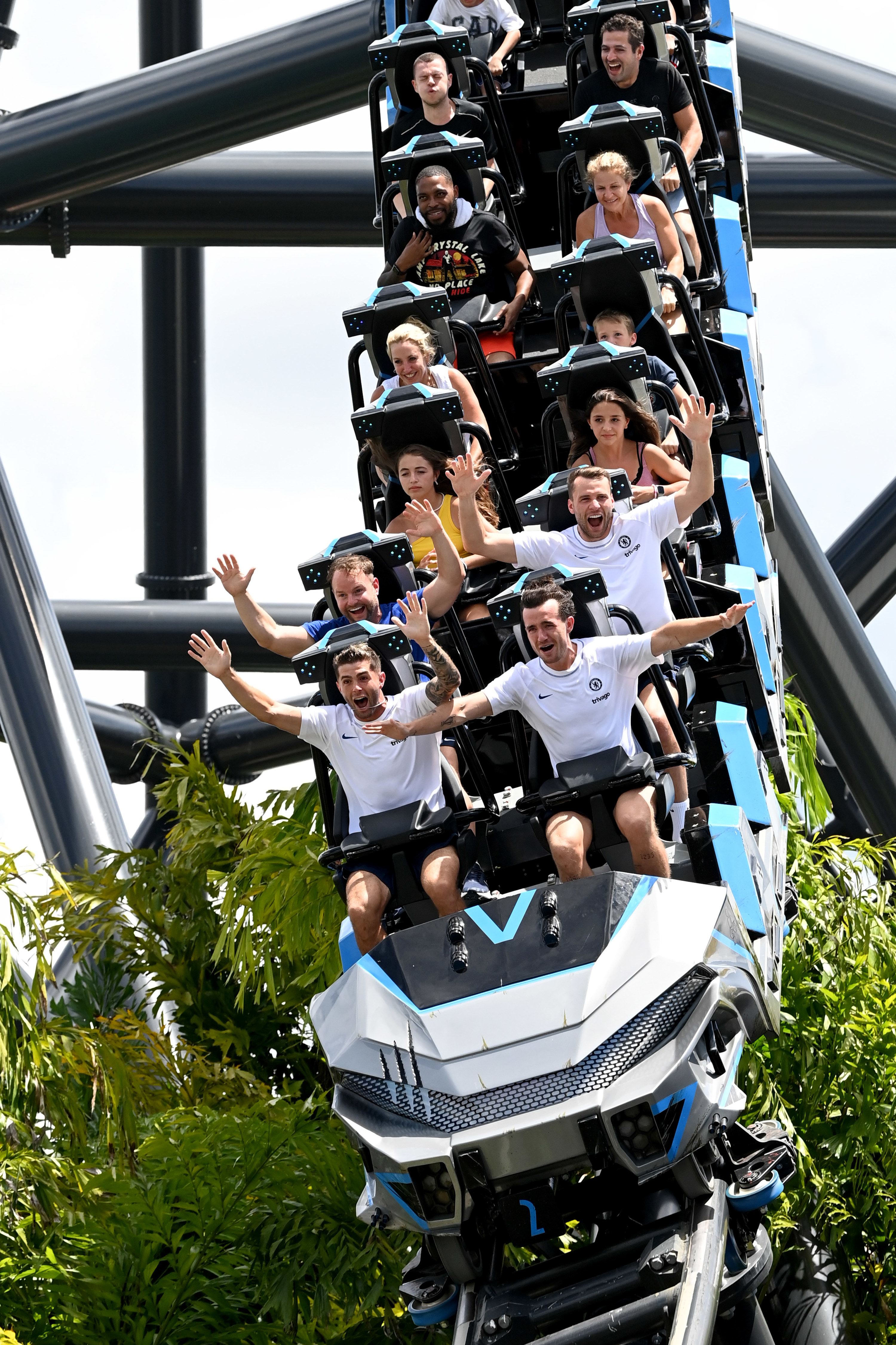 Stock photo of a group of people riding the VelociCoaster