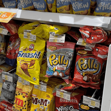Different packets of snacks on shelves