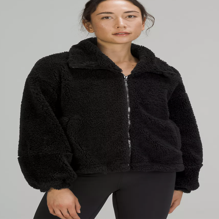 A person wearing the jacket with leggings
