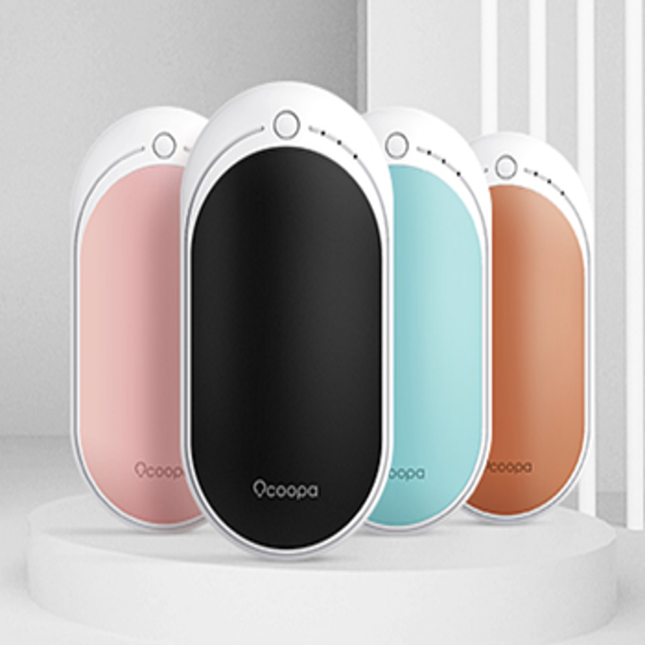 The oval shaped hand warmers in pink, black, blue, and orange with a button on top of each to adjust heat setting