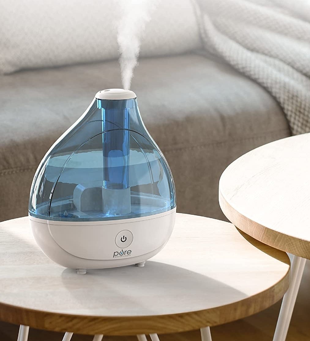 a humidifier in a living room on a low table