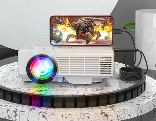 a phone plugged into a projector