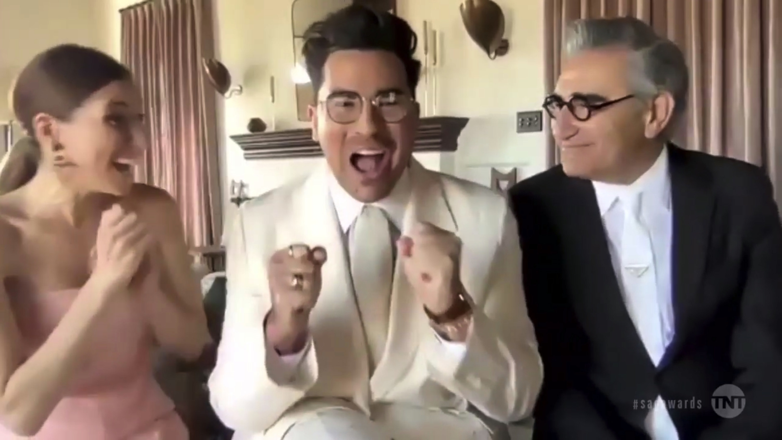 In this screengrab released on April 4, 2021, Sarah Levy, Dan Levy, and Eugene Levy, winners of Outstanding Performance by an Ensemble in a Comedy Series for &quot;Schitt&#x27;s Creek&quot;, speak during the 27th Annual Screen Actors Guild Awards