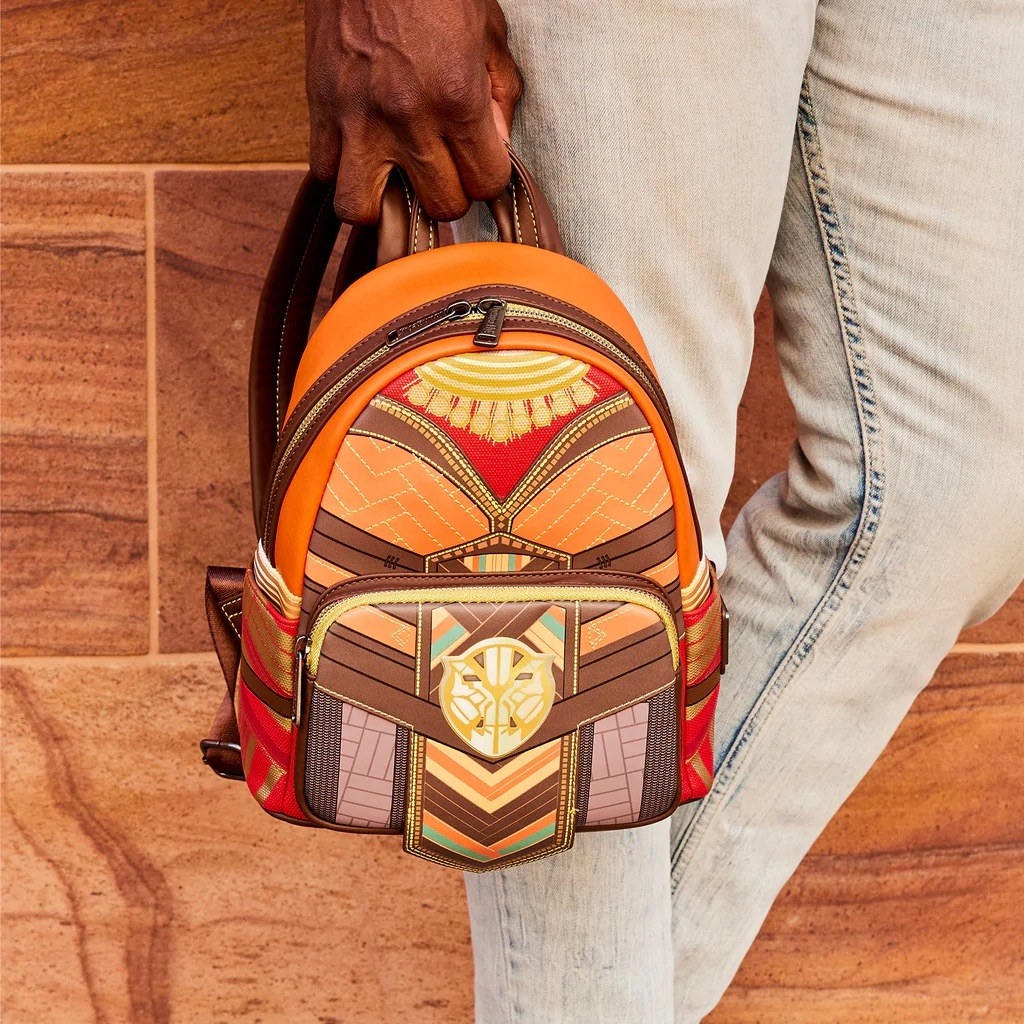 A mini backpack with a pattern print on it that looks like Okoye&#x27;s uniform from Blak Panther