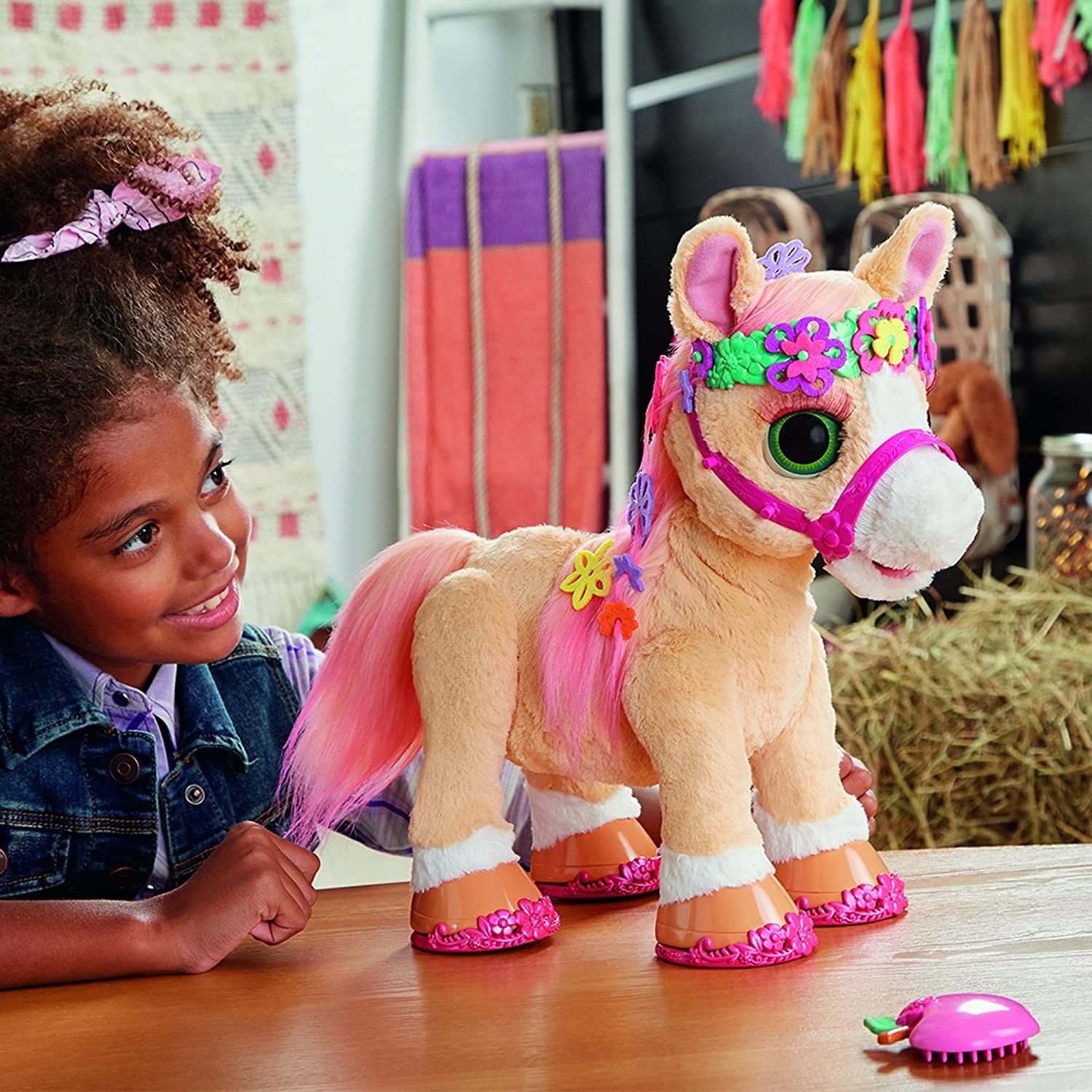 a child playing with the horse while the horse is wearing accessories