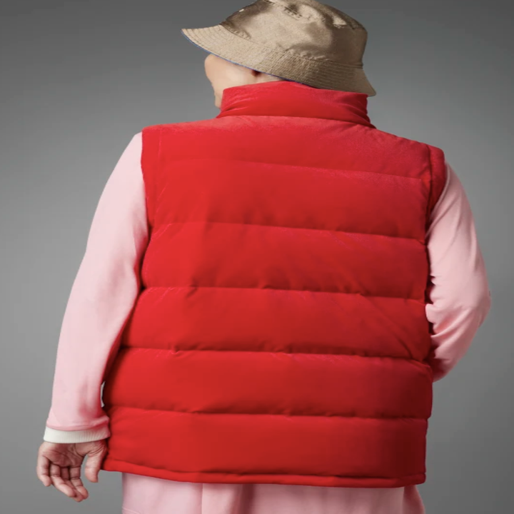 A person showing off the back of the puffer vest