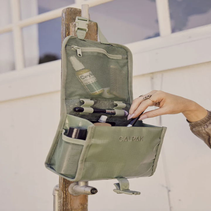 green hanging toiletry bag