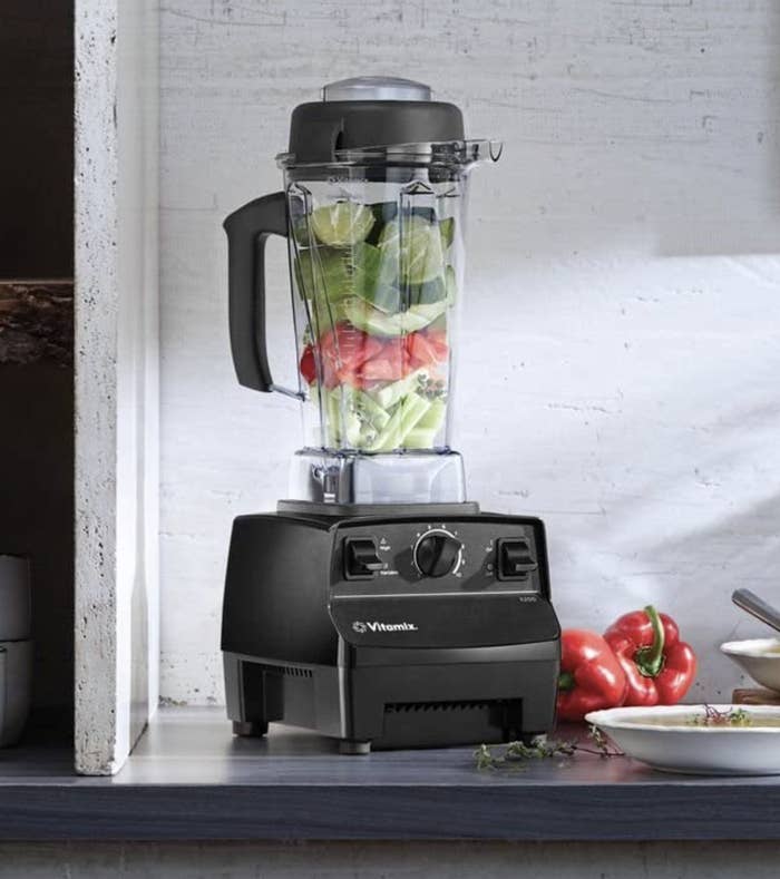 the blender on a counter with food in it