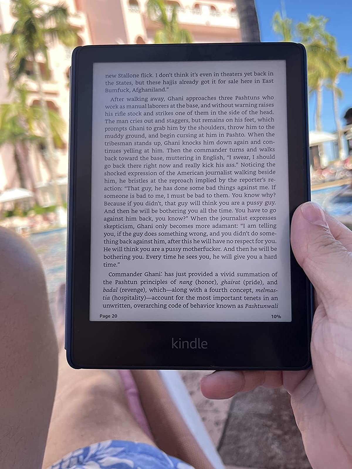 reviewer reading their kindle poolside