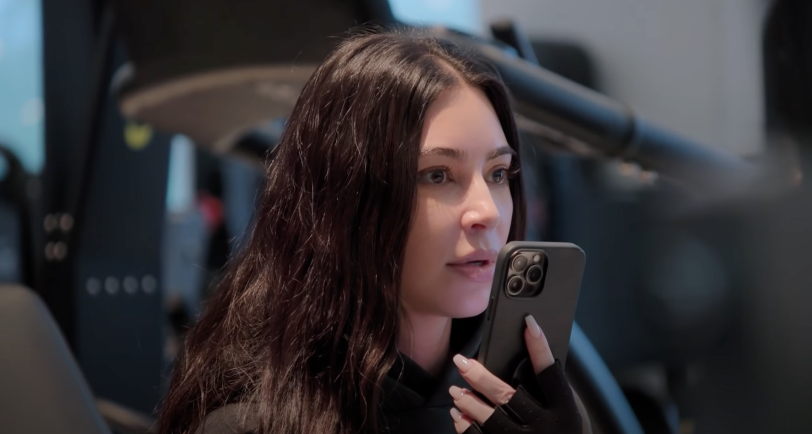 Close-up of Kim on the phone