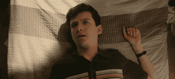 Actor playing a teen masturbating for first time and making orgasm face while floating off of bed into air