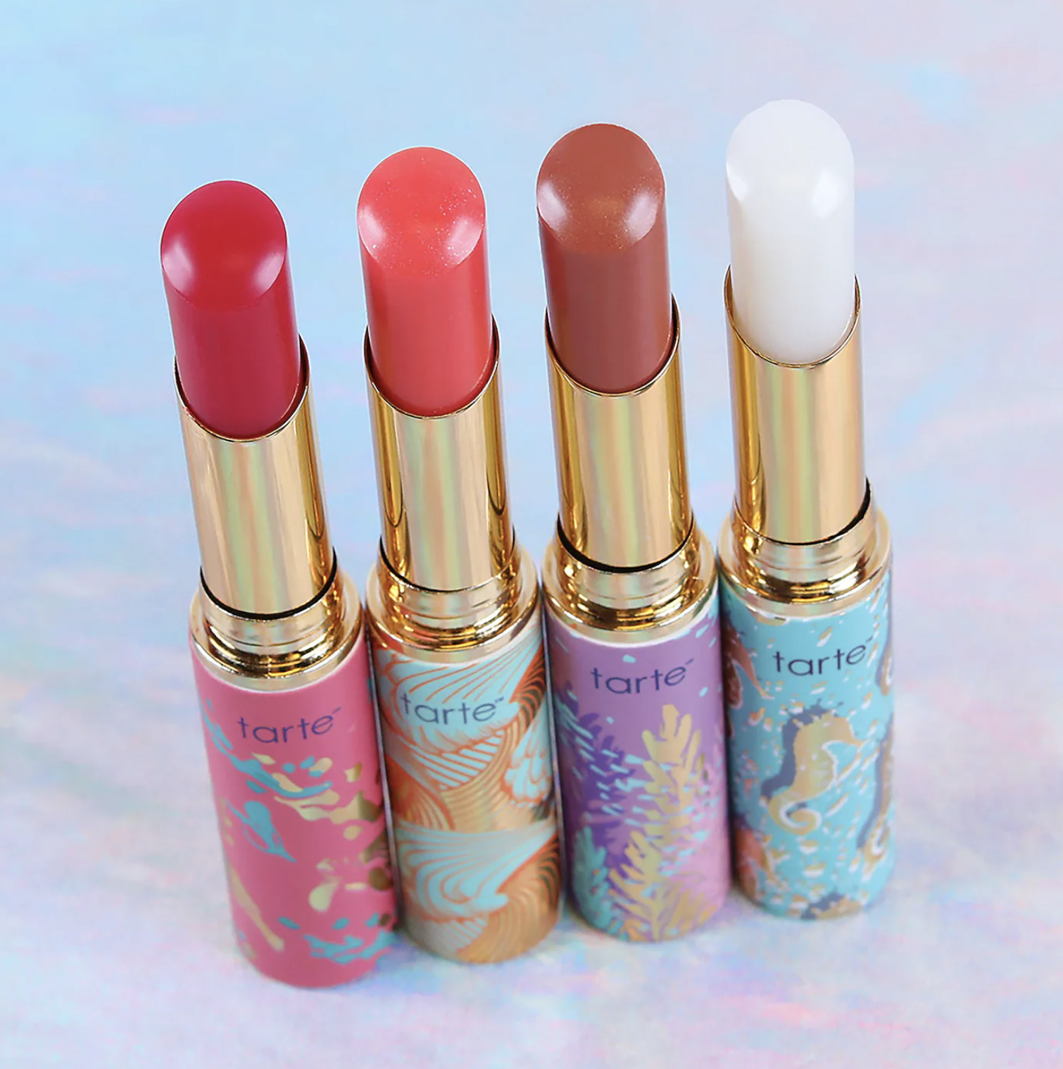 Four lip balms lined up