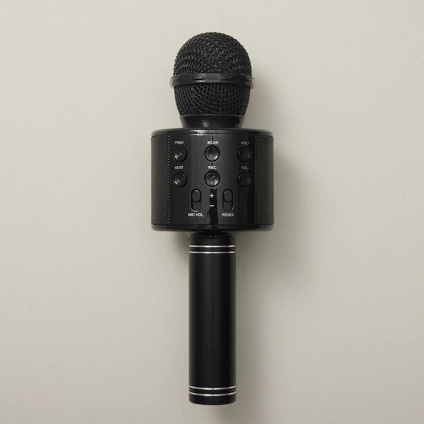 the microphone against a plain surface