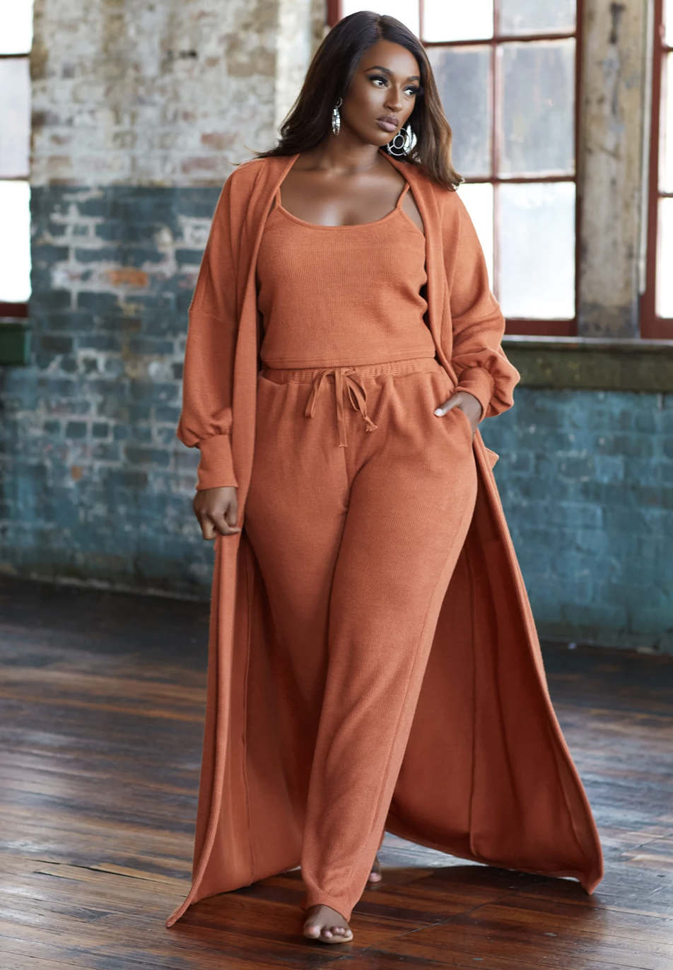 model in matching chestnut cardigan, tank top, and pant set