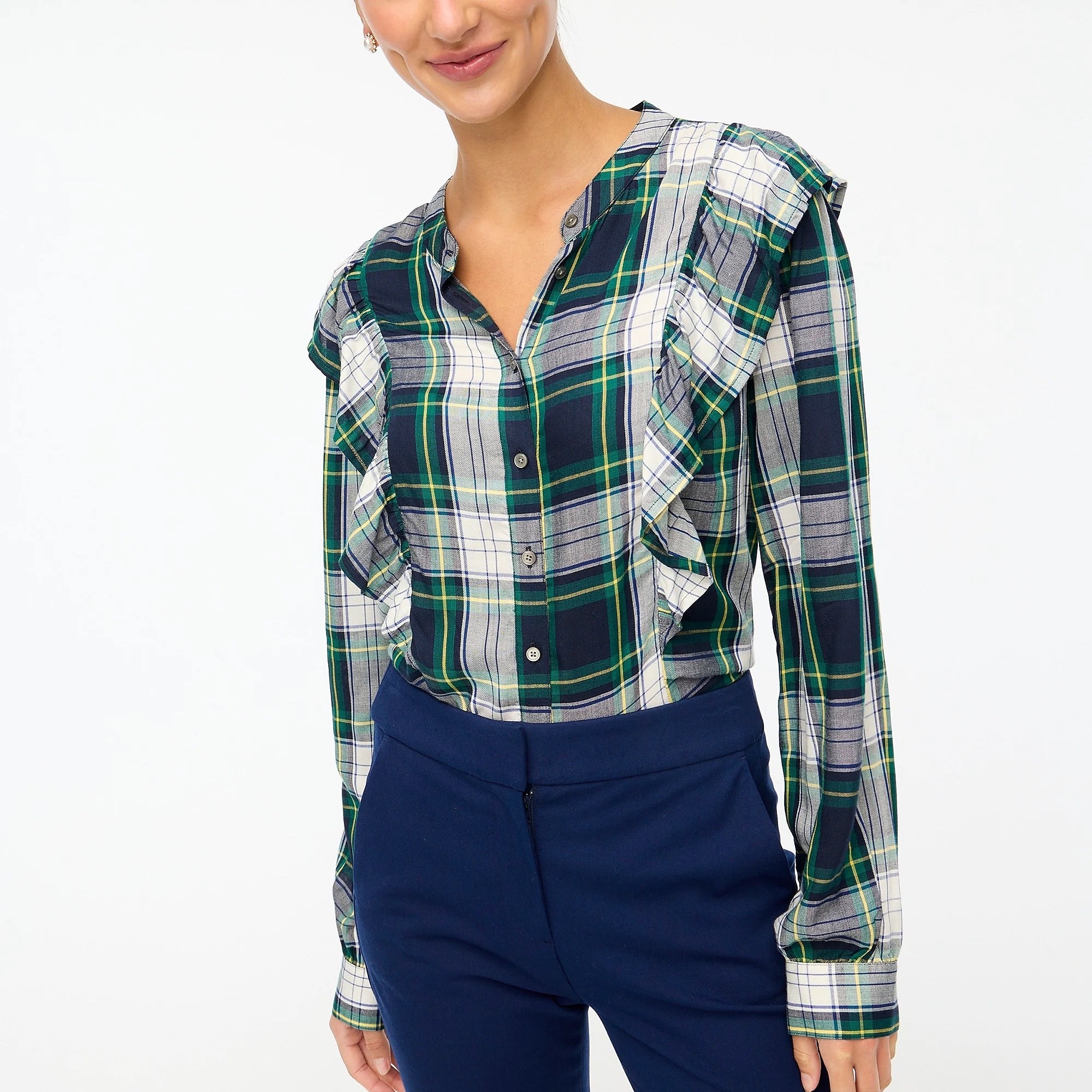 model in green and blue long sleeve button-down with twi ruffled on either side of the chest