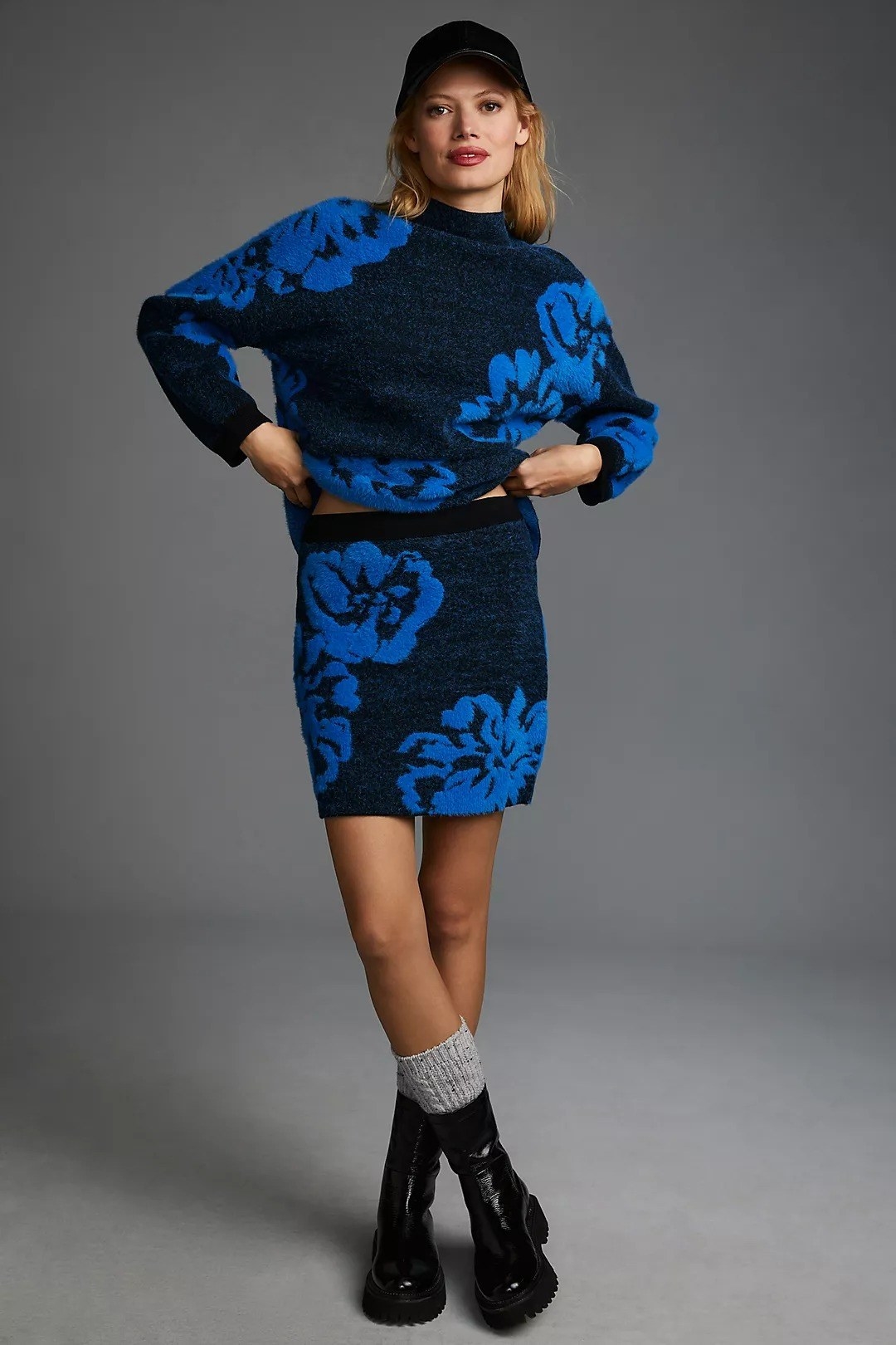 model wearing the blue sweater set with socks and black boots