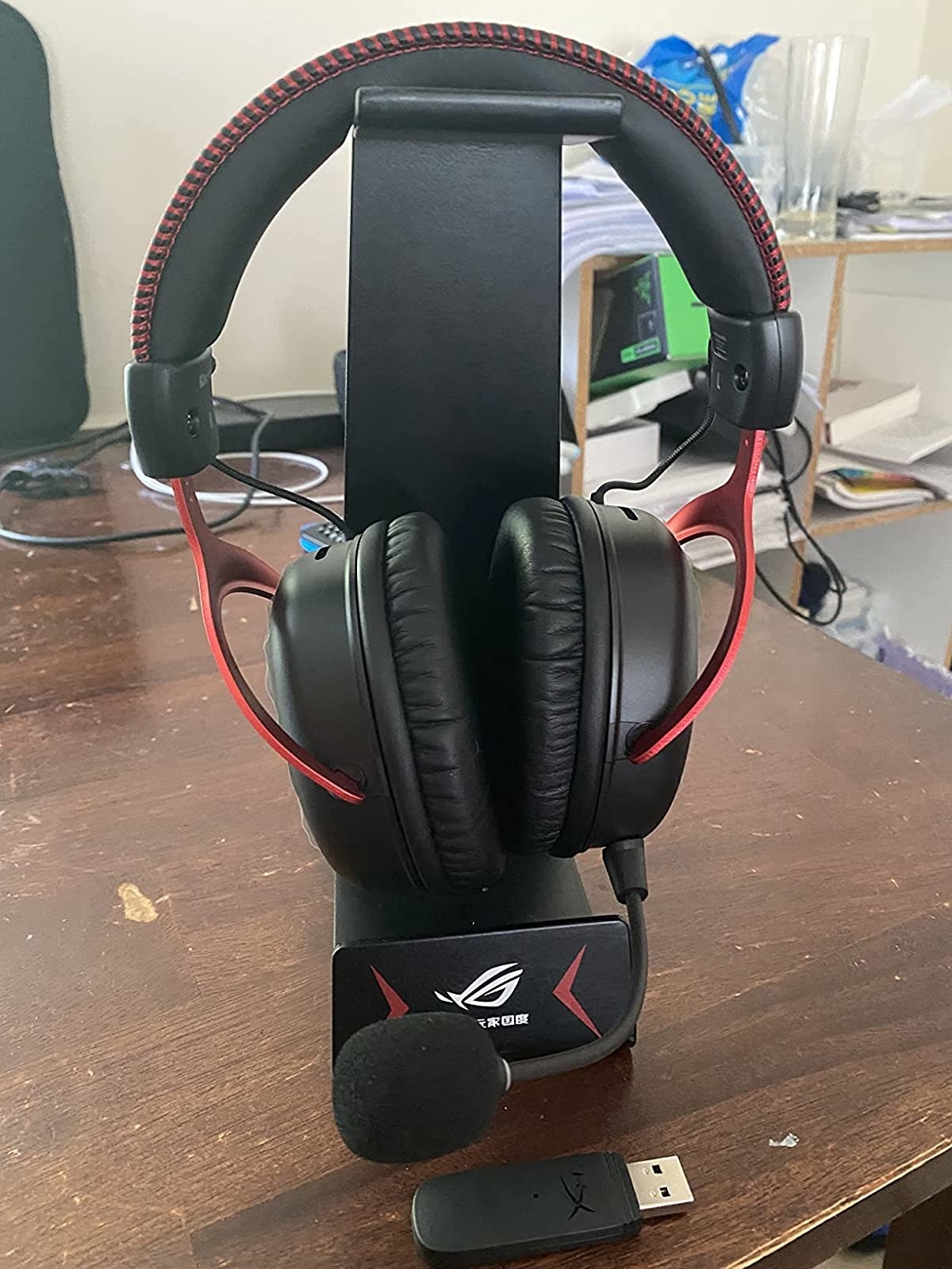 a reviewer photo of the headset on a stand