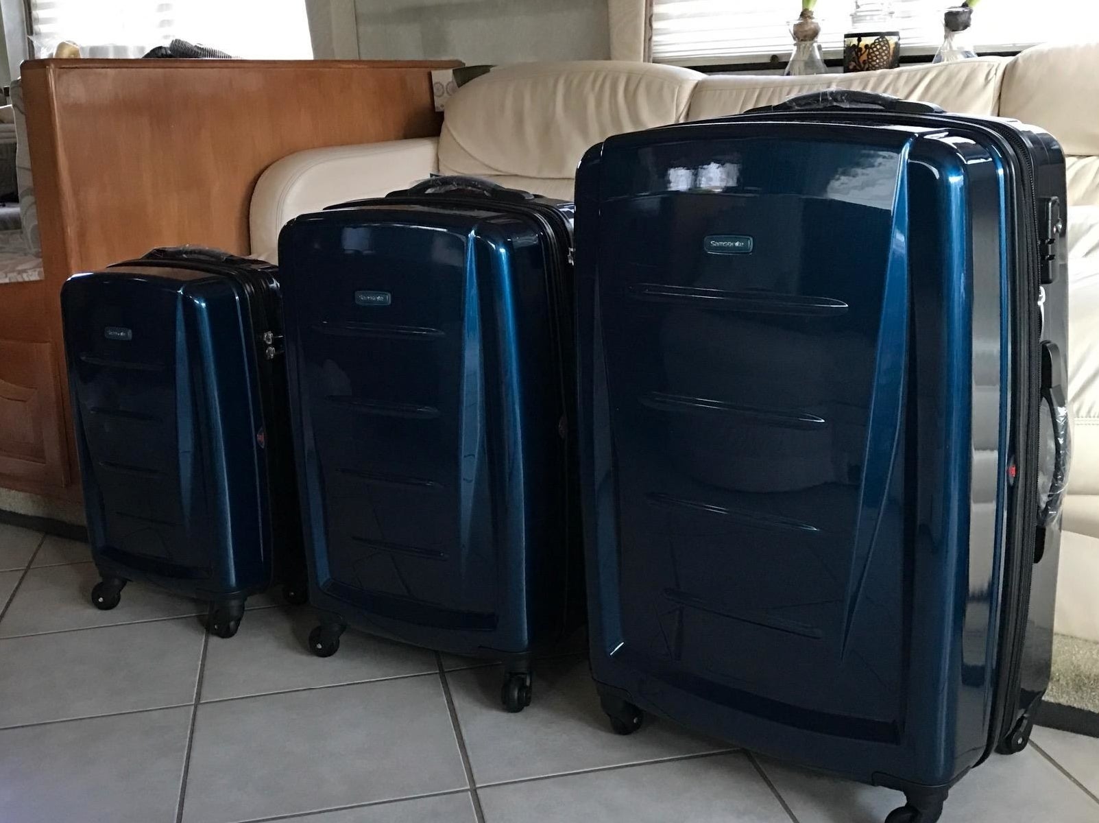 Reviewer image of three blue pieces of luggage