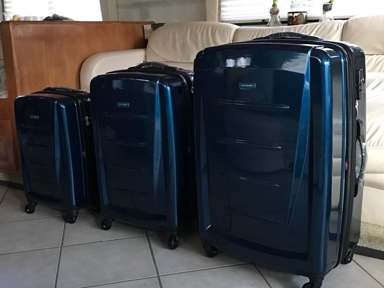 Reviewer image of three blue pieces of luggage