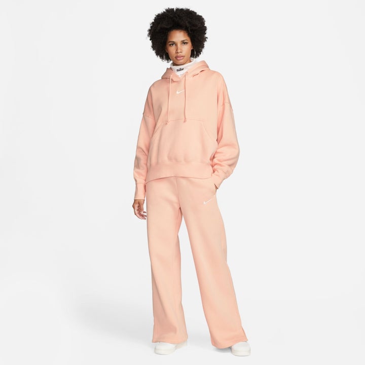 model wearing a peach pullover hoodie