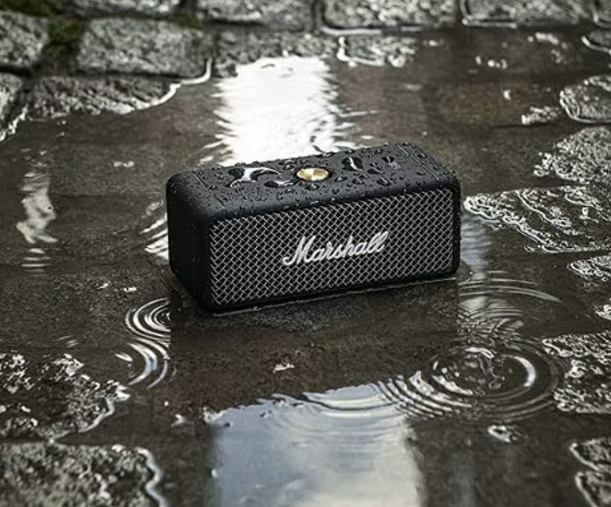 the speaker sitting in a puddle outside