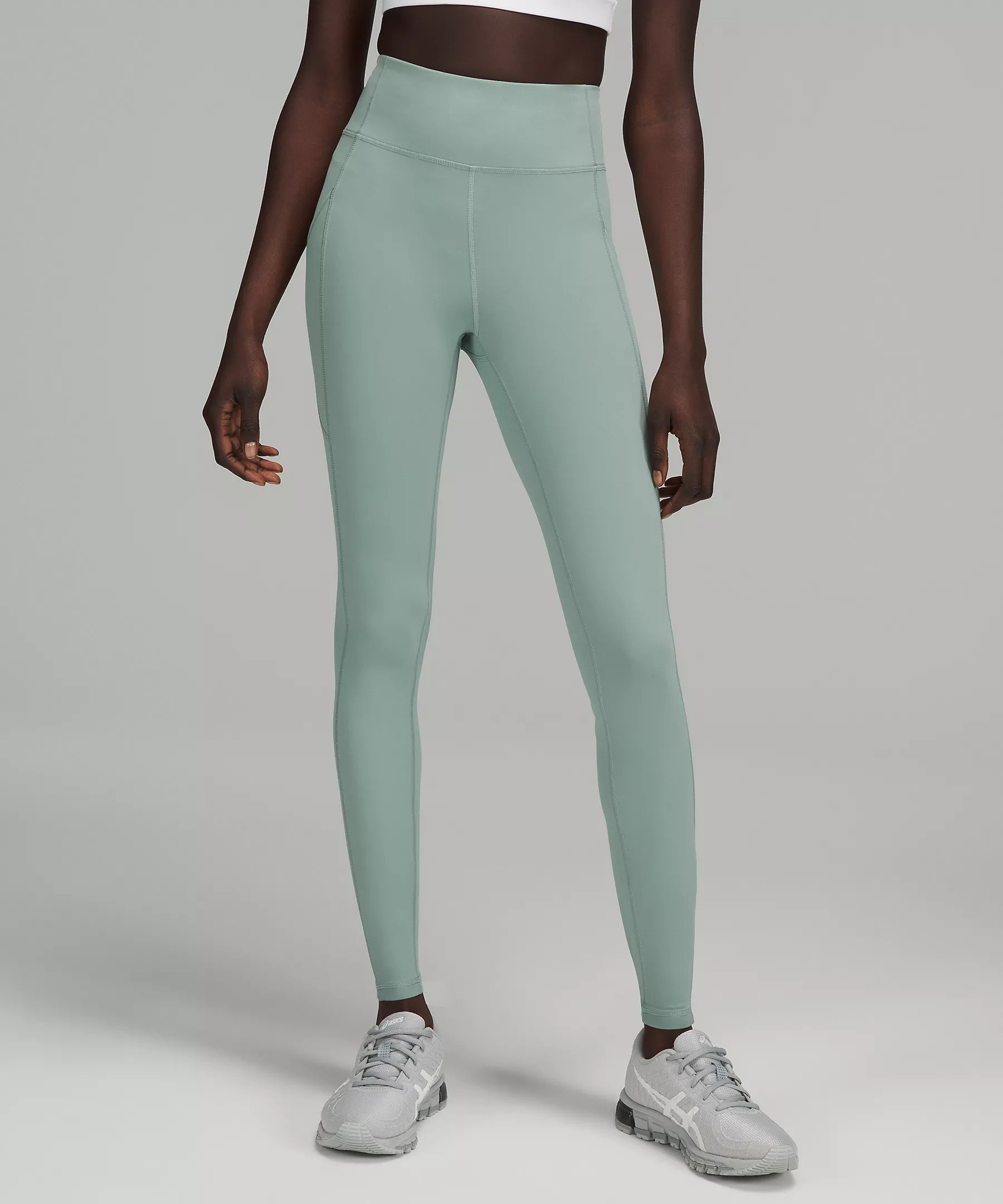 Model in green high rise leggings