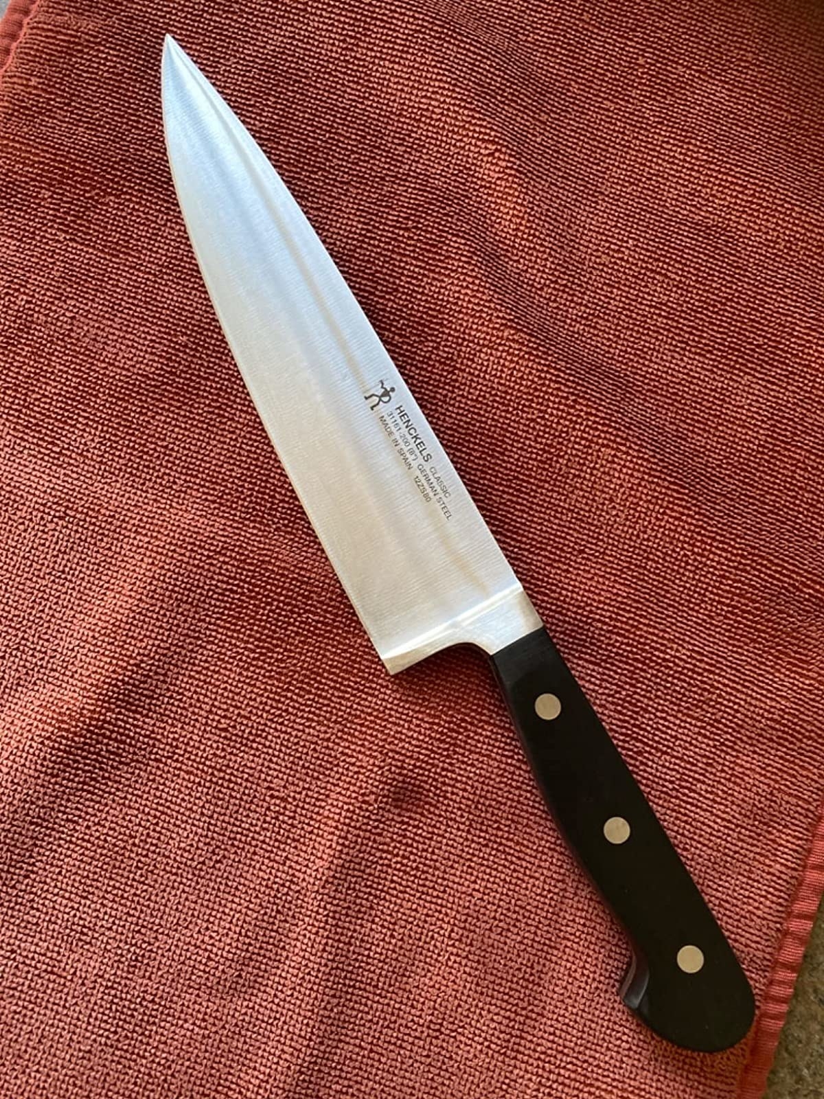 reviewer photo of the knife on a red towel