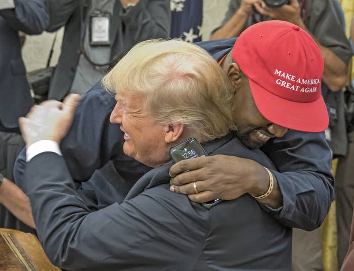 Donald Trump and Ye embracing